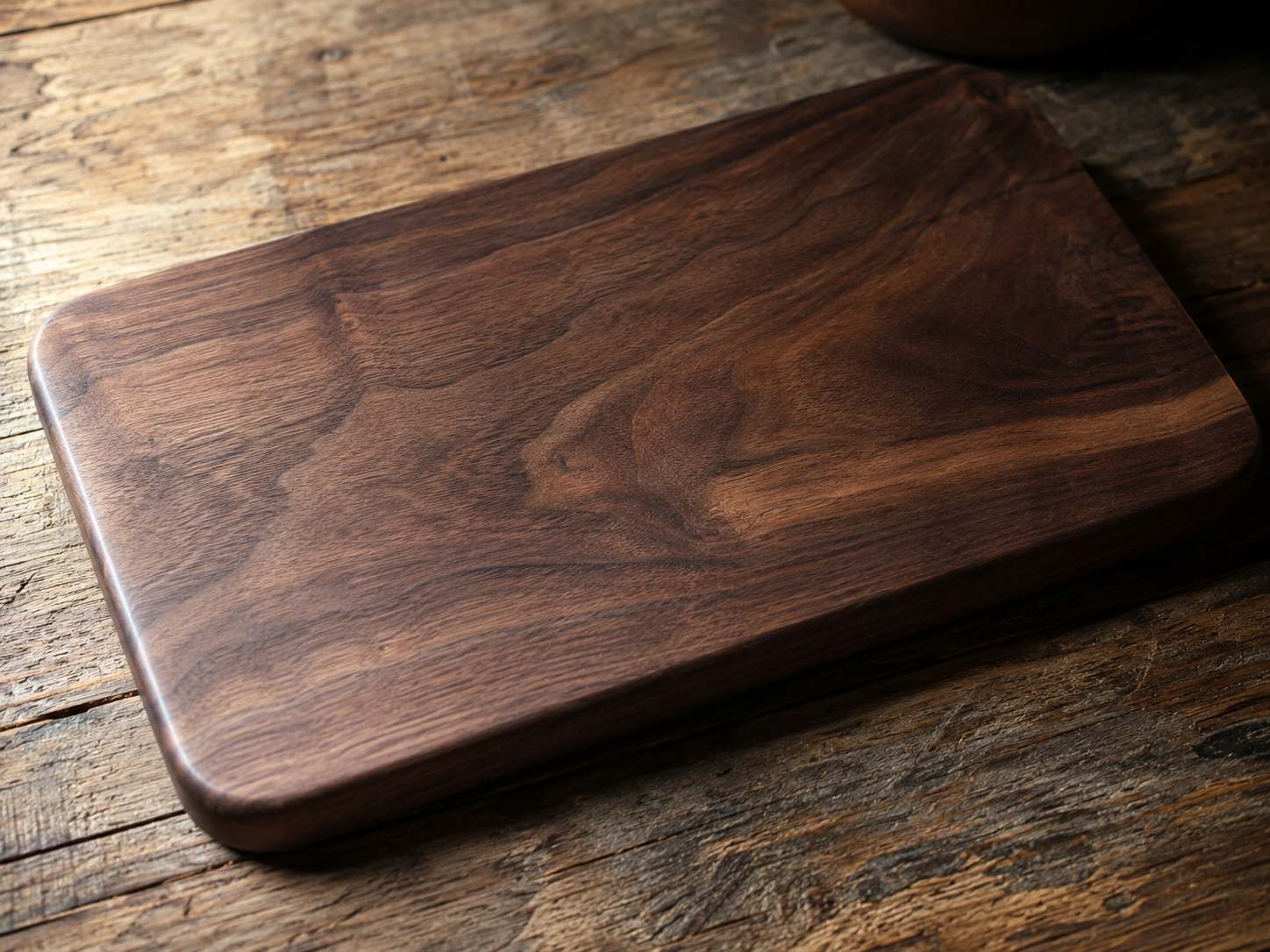 Close-up of a walnut chopping board showing dark rich grain